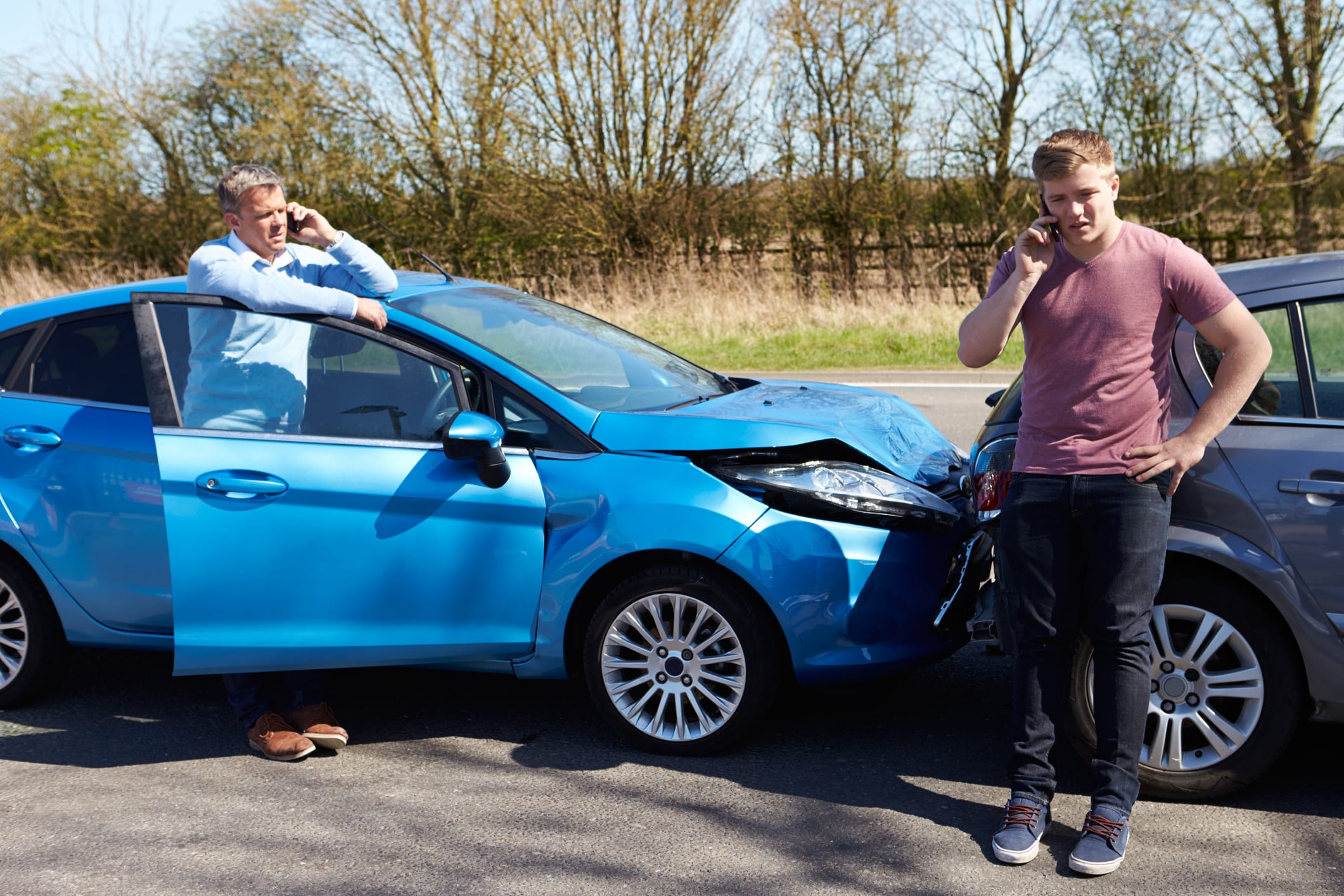 drivers Making Phone Call After Traffic Accident